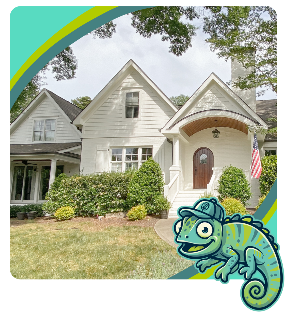 Exterior view of a freshly painted two-story home with white siding, white trim, and a covered front porch. Paint EZ's mascot, Chromo the chameleon, appears in the lower-right corner.