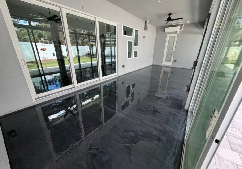 Epoxy floor coating installed in a sunroom by Paint EZ crew.