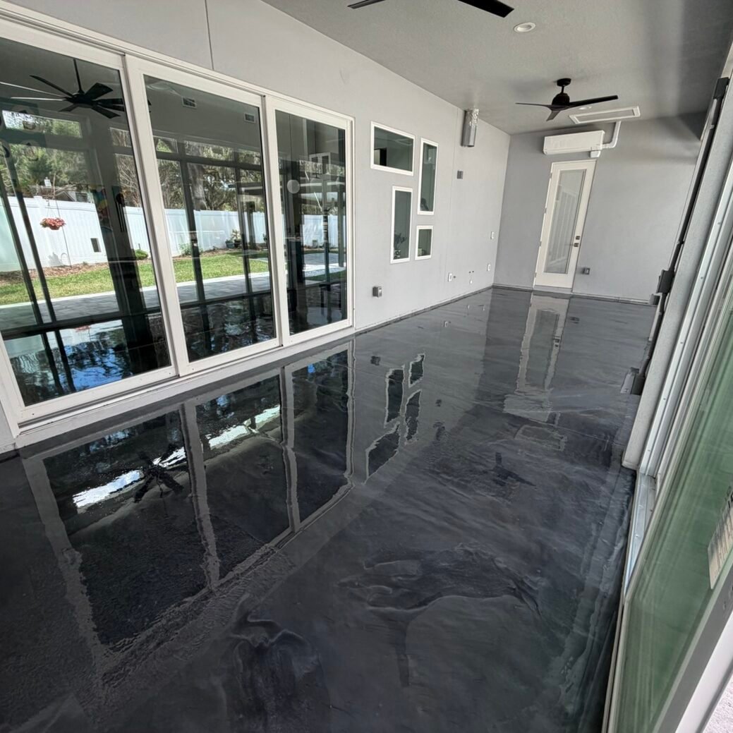 Epoxy floor coating installed in a sunroom by Paint EZ crew.