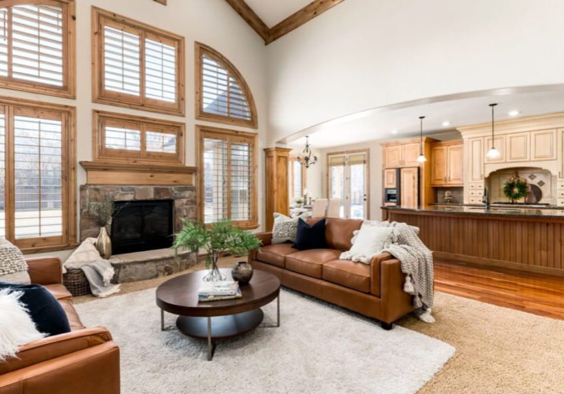 Living room interior painting project with neutral tones and vaulted ceiling by Paint EZ