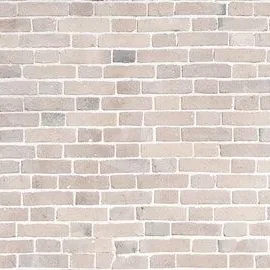 Close-up of lime washed brick wall showing textured masonry surface and mortar joints