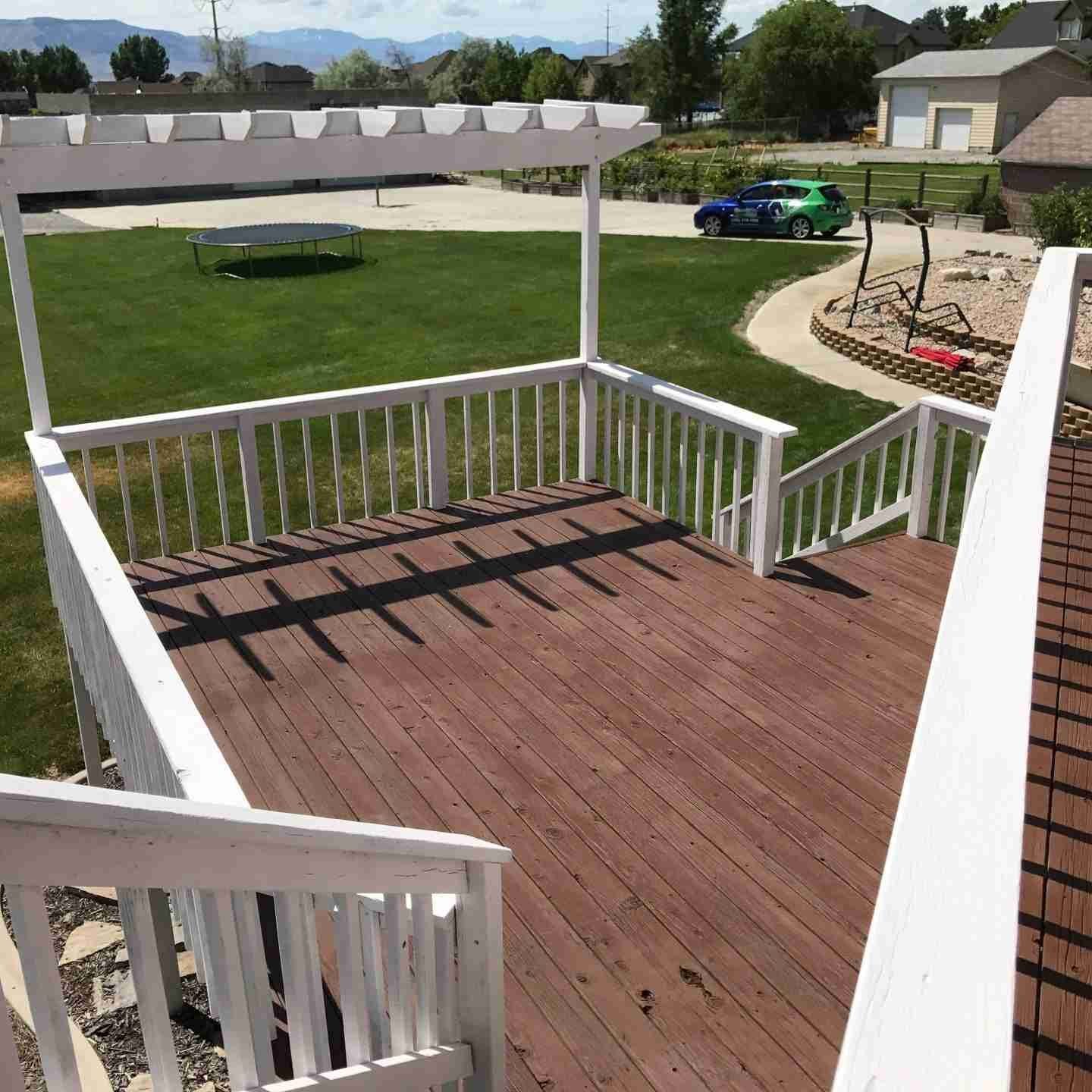 Wood painting and staining service by Paint EZ for decks, fences, interior/exterior doors, and more.