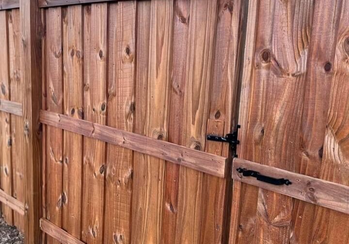 Close up of fence staining completed by Paint EZ house painters.