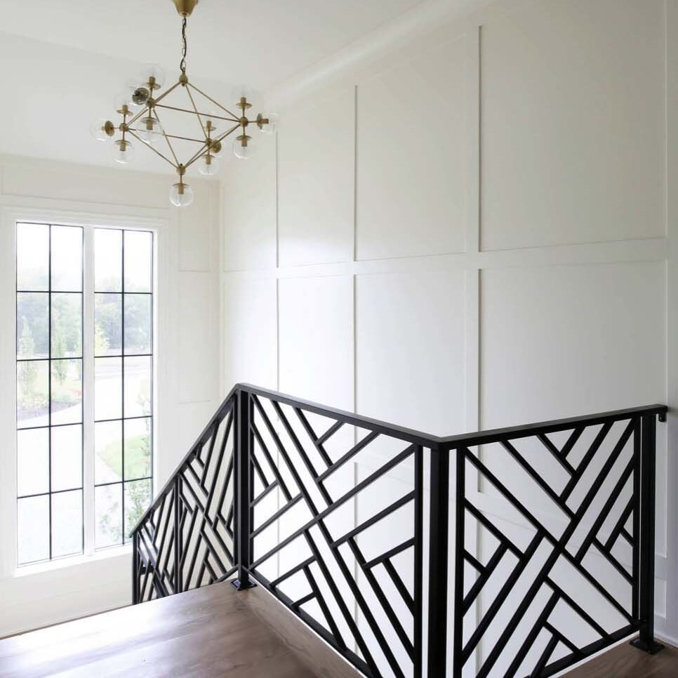 Paint EZ professional applying specialty coating to trim and walls