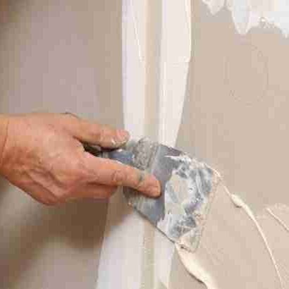 Professional drywall repair in progress by Paint EZ &ndash; expert drywall and carpentry repair services that restore smooth, flawless walls before painting.