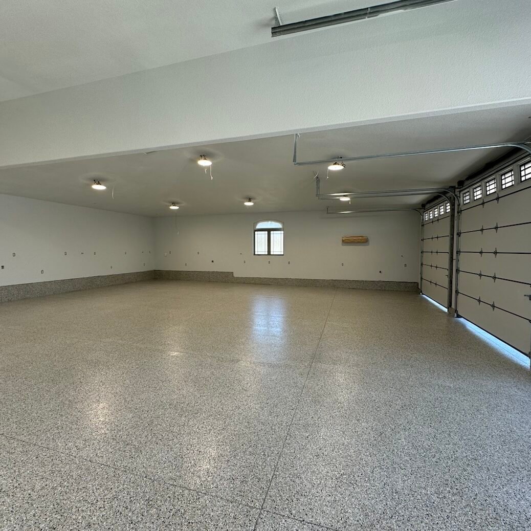 Durable polyaspartic garage floor coating by Paint EZ &ndash; professional garage floor services that protect and enhance concrete surfaces with long-lasting, polished finishes.