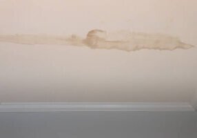 Water damage in the ceiling that Paint EZ can repair.